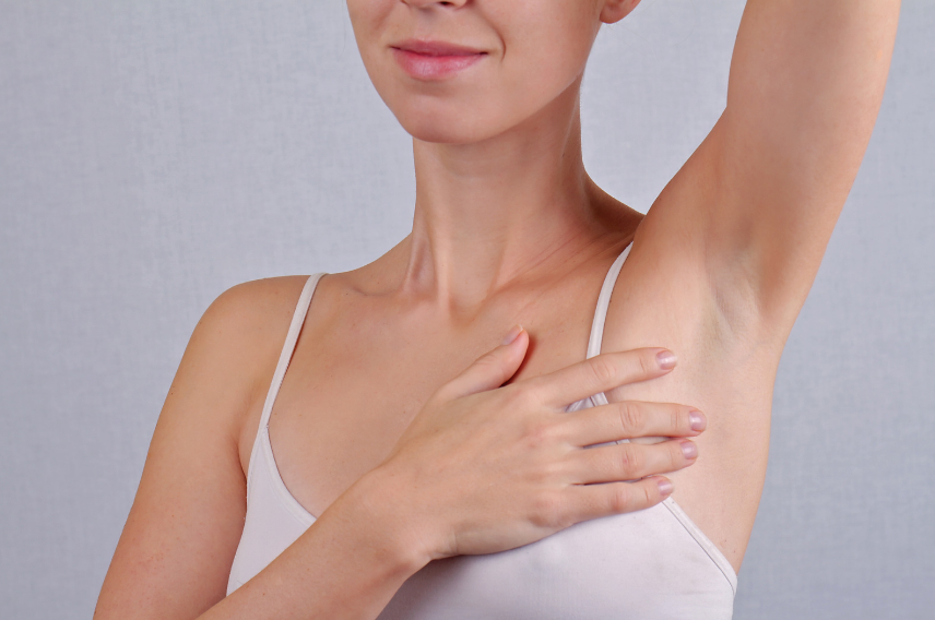 Woman lifting her arm to show no hair