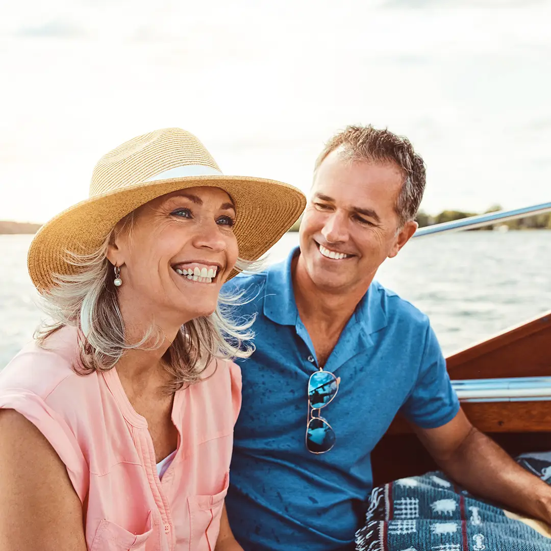 happy couple in a boat on the water